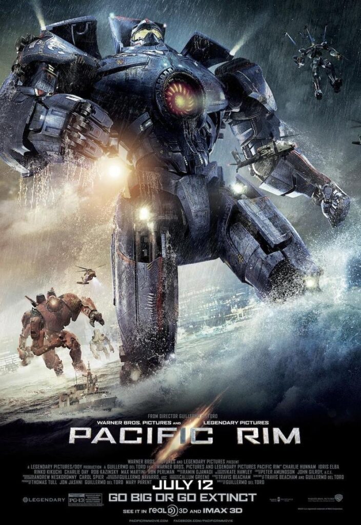 A Poster for Pacific Rim. It shows one of the Jaegers, the Gipsy Danger, prominently in the foreground, stepping through coastal waters. In the waters behind it are two other units, and a fourth one being lifted in by helicopters. The vague outline of a city is visible in the background, a in the front an already small fishing boat is dwarfed by the towering Jaeger.