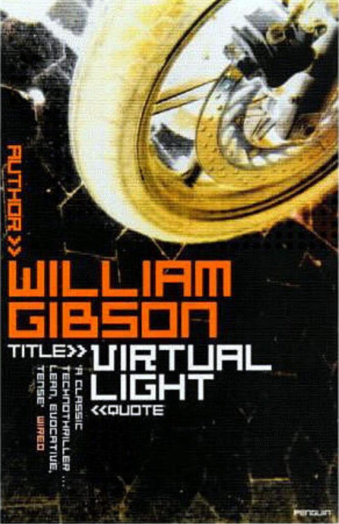 A Cover for Virtual Light, by William Gibson.
Is shows in what looks to me like a photo-negative a small bike tire with a brake disc nearly as big as itself in the upper part.
In the lower part the author, the title and a quote from Wired magazine about the book are printed in blocky letters, each of them pointed at by the words "author", "title", and "quote" followed by a ">>".